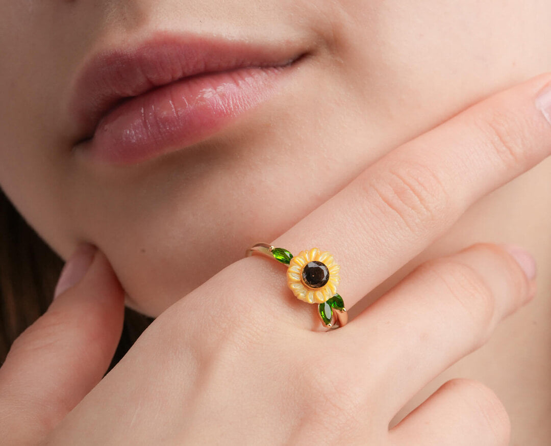 Close up of Mondays Made's Carved Sunflower Ring in 18k Gold Vermeil worn on a model
